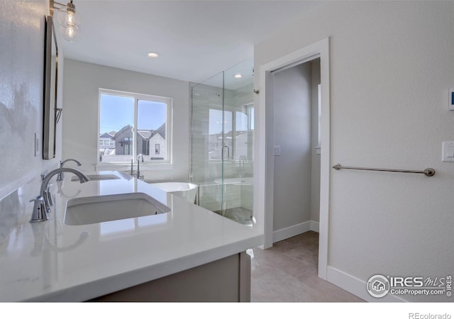 bathroom featuring walk in shower and vanity