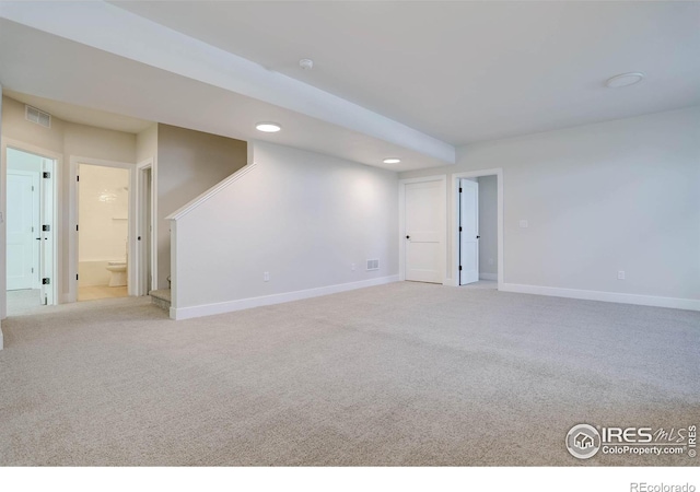 empty room with light colored carpet