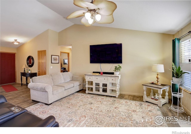 living room with lofted ceiling, wood-type flooring, and ceiling fan