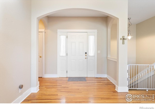 foyer featuring wood-type flooring