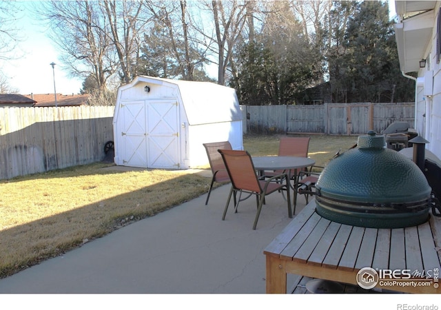 view of patio / terrace featuring a shed