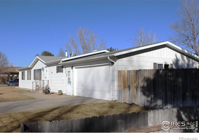 view of side of property featuring a garage