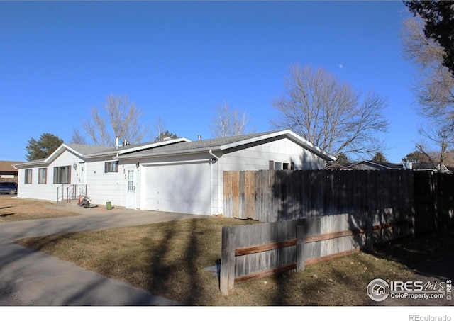 view of side of property featuring a garage