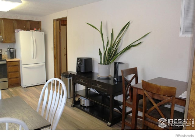 dining space featuring light hardwood / wood-style flooring