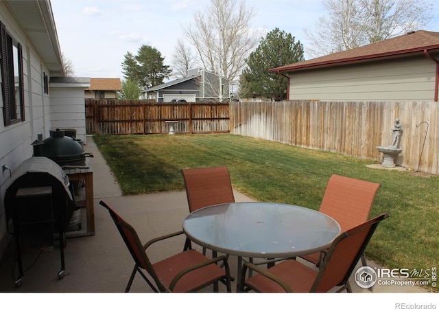 view of patio / terrace featuring outdoor dining space and a fenced backyard