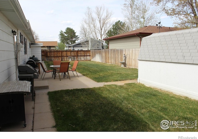 view of yard with a fenced backyard and a patio area