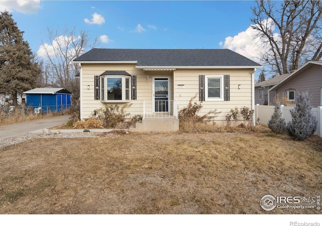 bungalow with a front yard