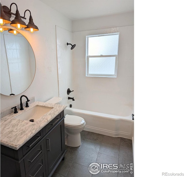 full bathroom with toilet, tiled shower / bath combo, and vanity