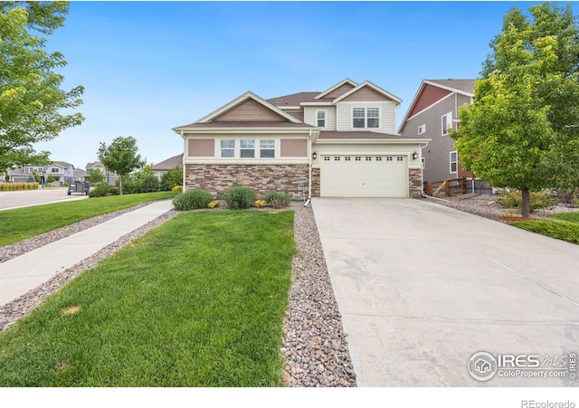 view of front of house with a front yard and a garage