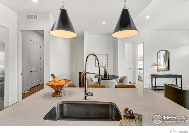 kitchen featuring pendant lighting and sink