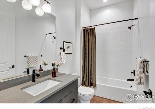 full bathroom with toilet, shower / tub combo, vanity, and hardwood / wood-style floors