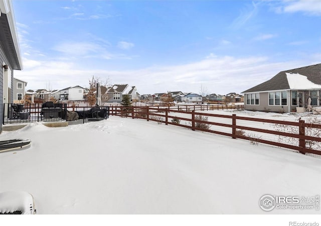 view of yard covered in snow