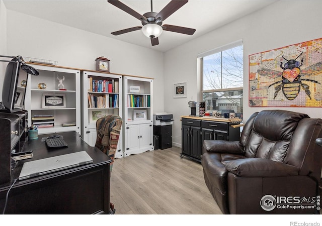 office area with ceiling fan and light hardwood / wood-style flooring