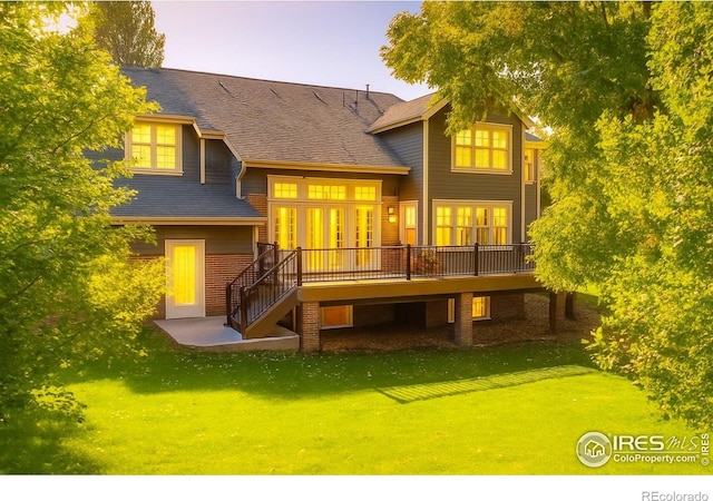 6345 Swallow Ln, Boulder, CO 80303 - rear view of house with a wooden deck, stairs, a yard, and a shingled roof