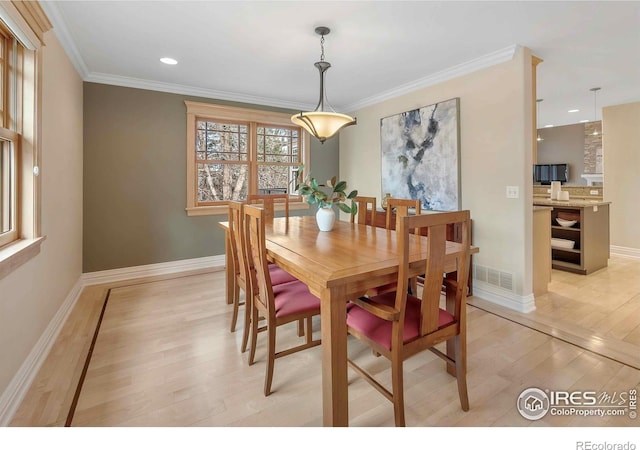 6345 Swallow Ln, Boulder, CO 80303 - dining room with light wood-style floors, crown molding, and recessed lighting