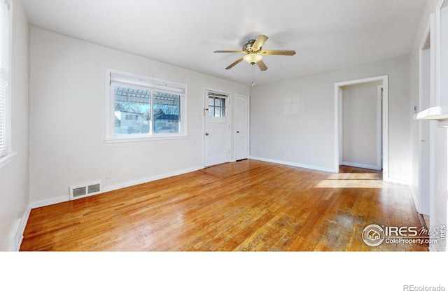 spare room featuring ceiling fan and hardwood / wood-style floors