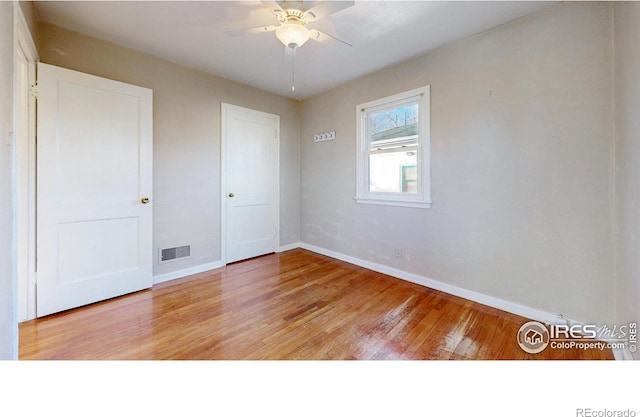 unfurnished bedroom with ceiling fan and light hardwood / wood-style flooring