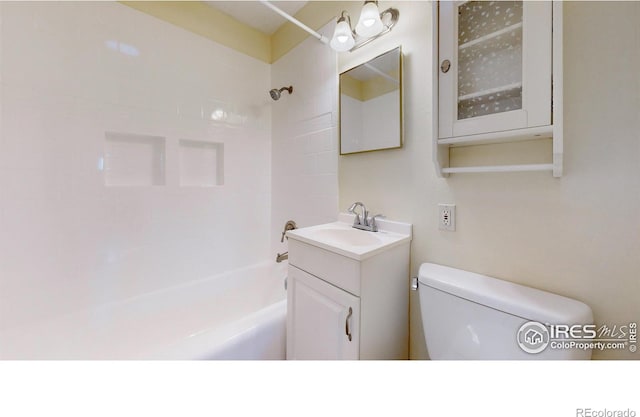 full bathroom featuring toilet, vanity, and shower / bathtub combination