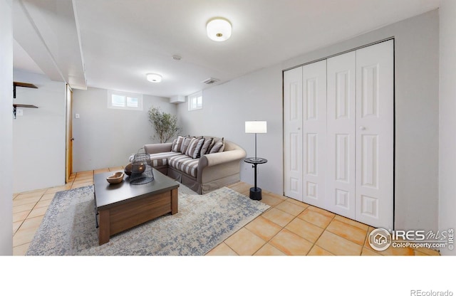 living room with light tile patterned floors