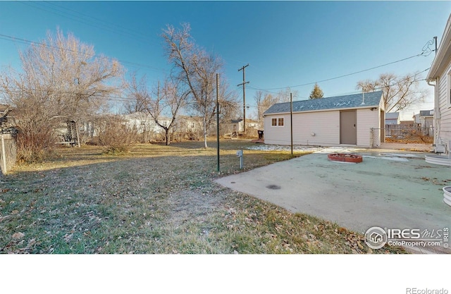 view of yard with a patio area and a fire pit