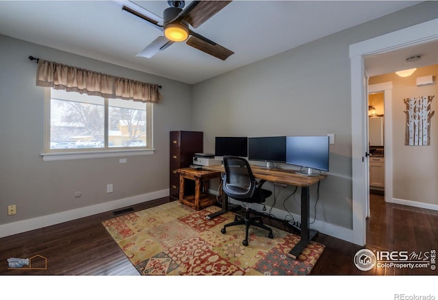 office space with ceiling fan and dark hardwood / wood-style flooring