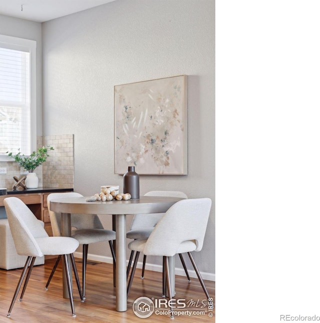 dining area featuring hardwood / wood-style floors