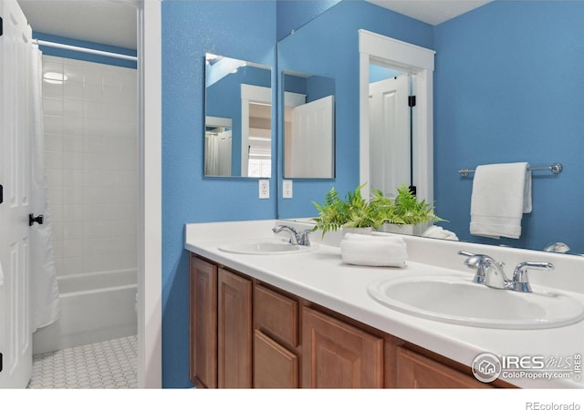 bathroom featuring vanity and shower / tub combo with curtain