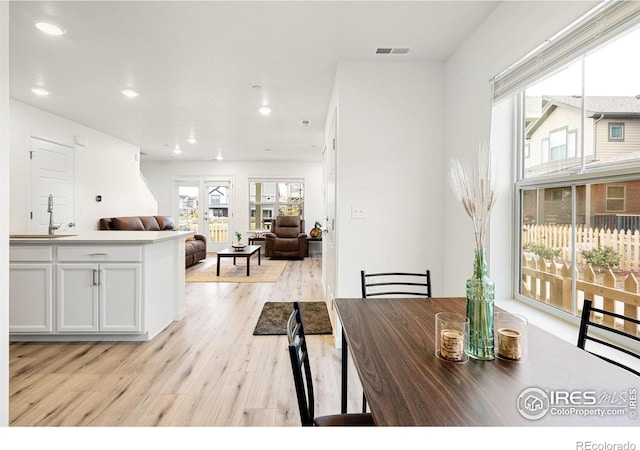 dining room featuring recessed lighting, visible vents, and light wood finished floors