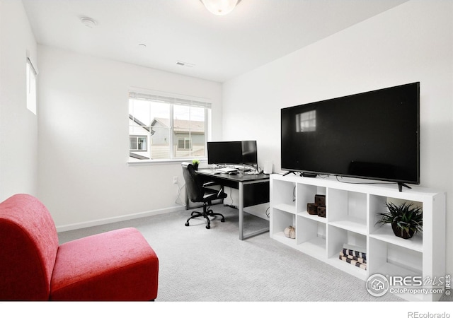 office area with light carpet, visible vents, and baseboards