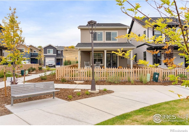 view of front of property featuring a fenced front yard and a residential view