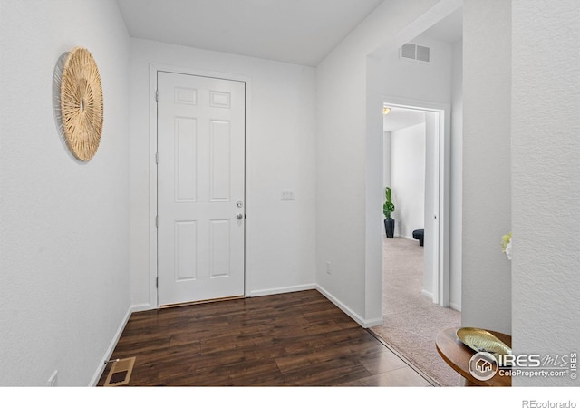 hallway featuring dark hardwood / wood-style floors