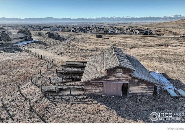 exterior space with a mountain view and a rural view