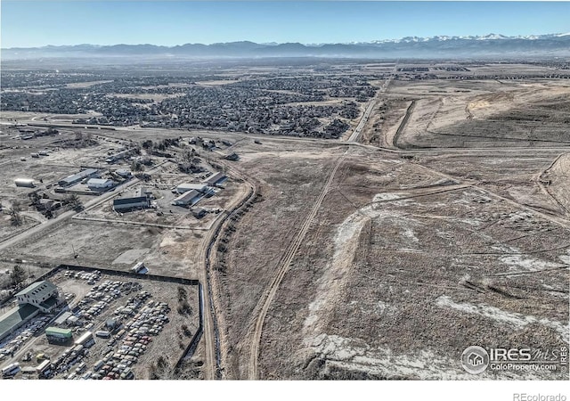 birds eye view of property featuring a mountain view