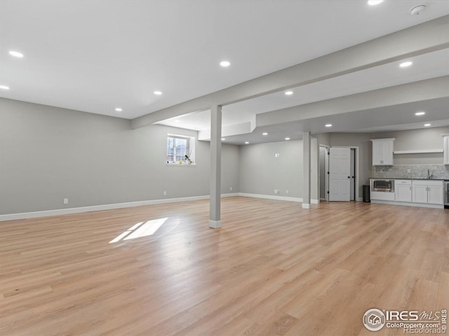 basement featuring light wood-type flooring