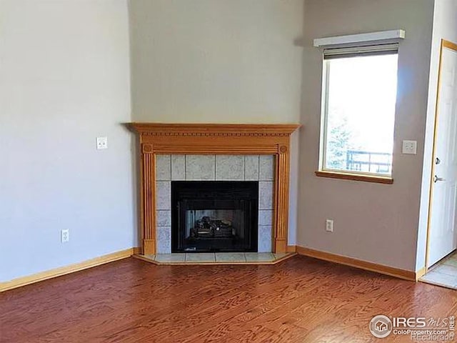 interior details featuring a fireplace and hardwood / wood-style floors