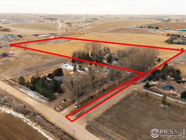 birds eye view of property with a rural view