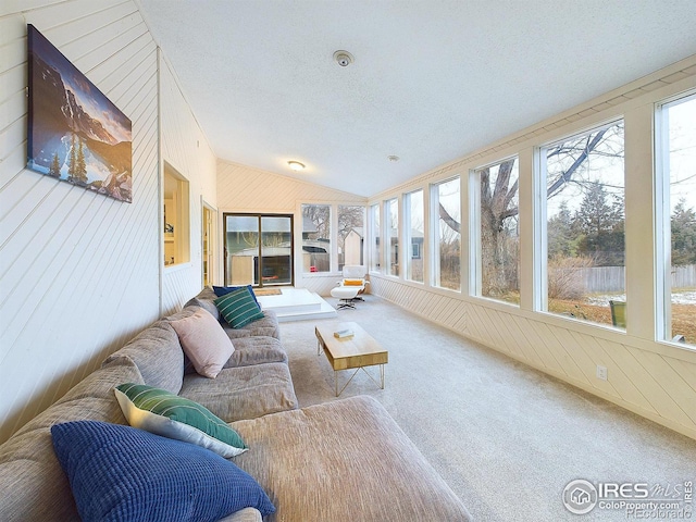 sunroom featuring lofted ceiling