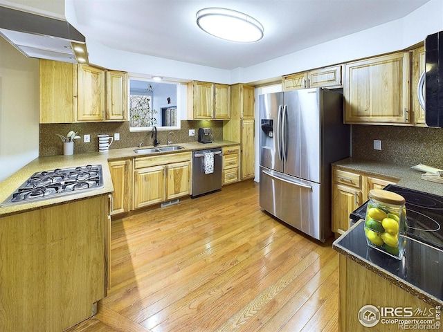 4667 Ashfield Dr, Boulder, CO 80301 - kitchen with appliances with stainless steel finishes, light wood-type flooring, decorative backsplash, and exhaust hood