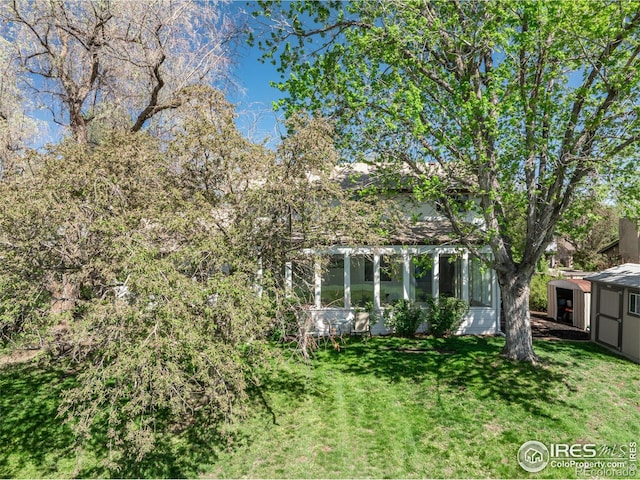 4667 Ashfield Dr, Boulder, CO 80301 - view of green lawn with a sunroom