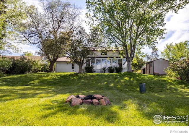 4667 Ashfield Dr, Boulder, CO 80301 - view of grassy yard with an outbuilding