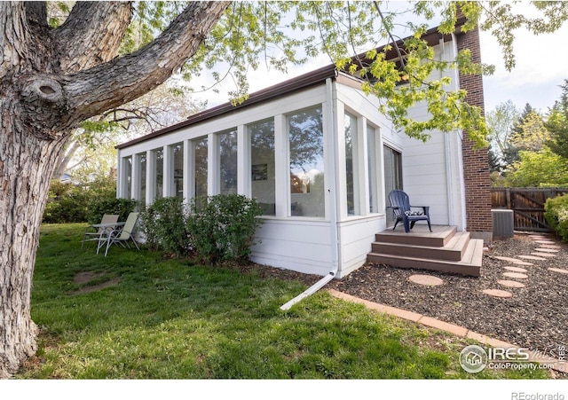 4667 Ashfield Dr, Boulder, CO 80301 - view of side of home with a sunroom and a cooling unit
