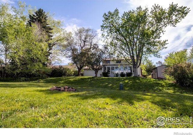 4667 Ashfield Dr, Boulder, CO 80301 - view of grassy yard featuring a garage