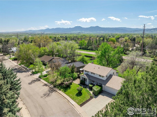 4667 Ashfield Dr, Boulder, CO 80301 - drone / aerial view of a mountain backdrop and a heavily wooded area