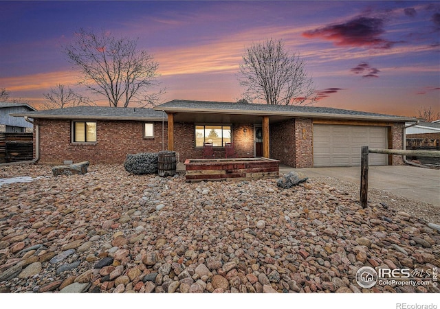 ranch-style home featuring a garage