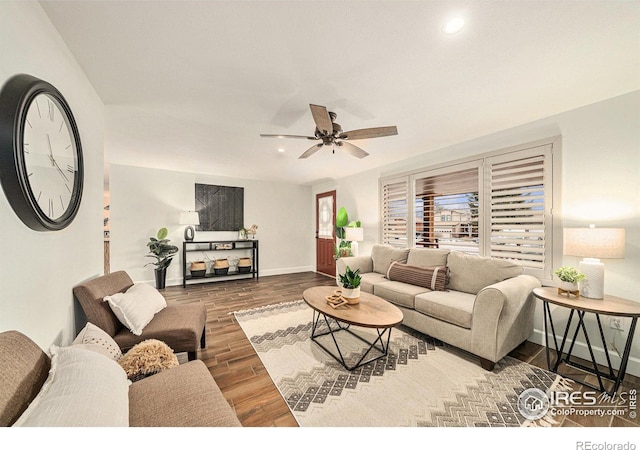 living room featuring ceiling fan and hardwood / wood-style floors