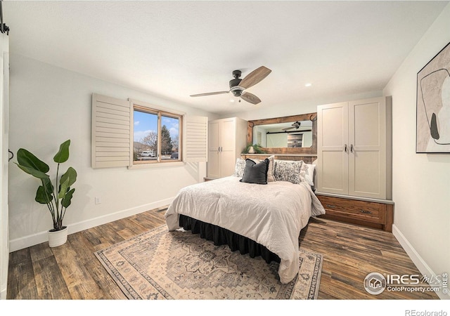 bedroom featuring ceiling fan and dark hardwood / wood-style flooring