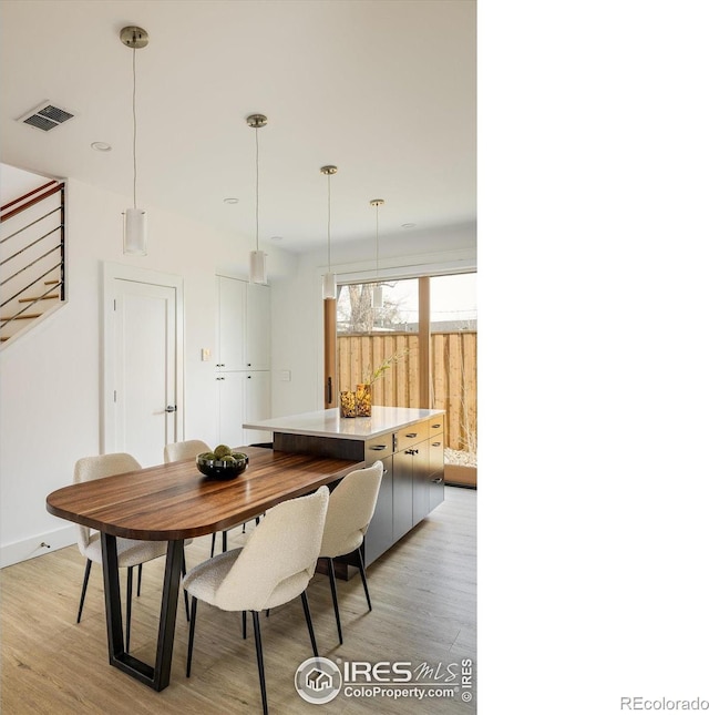 dining area featuring light wood-type flooring