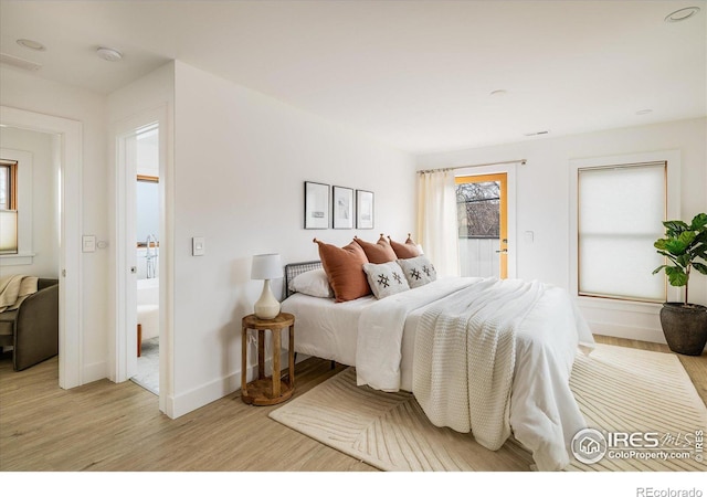 bedroom with light hardwood / wood-style floors