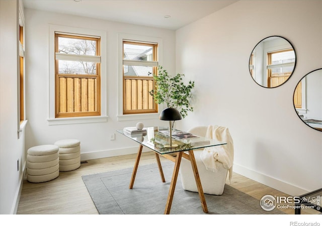 dining space with light hardwood / wood-style floors