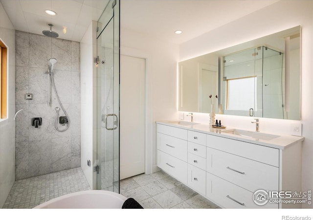 bathroom featuring an enclosed shower and vanity